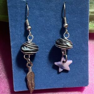 Mismatched earrings purple star, feather, and stone beads